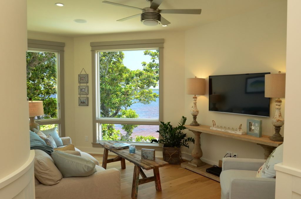 Adams sitting room with view of the water designed and constructed by Rita Jones Construction in Northwest Florida