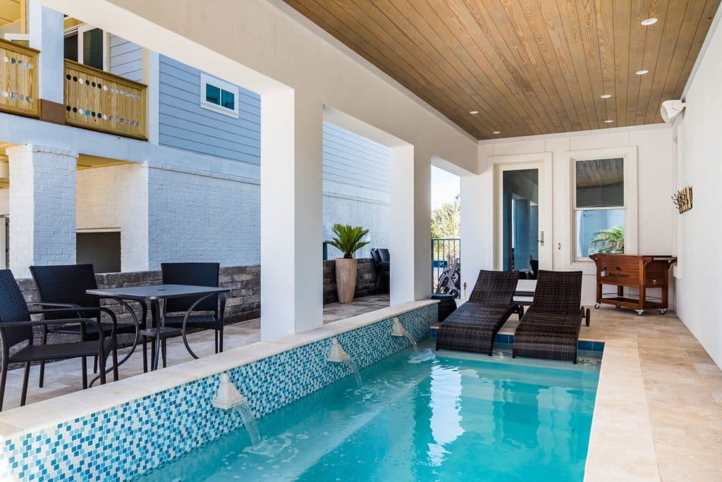 Kakkar Outdoor patio with covered pool designed & constructed by Rita Jones Construction in Panama City Beach Florida