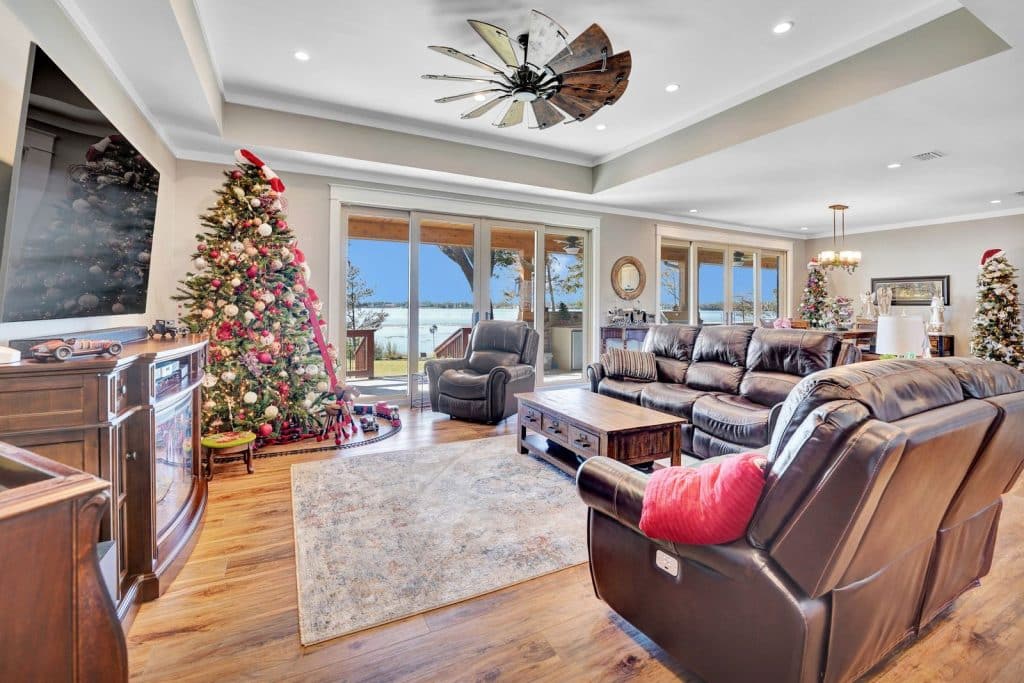 Barros home grand living room decorated for Christmas with view of the water designed and constructed by Rita Jones Construction in Panama City Florida