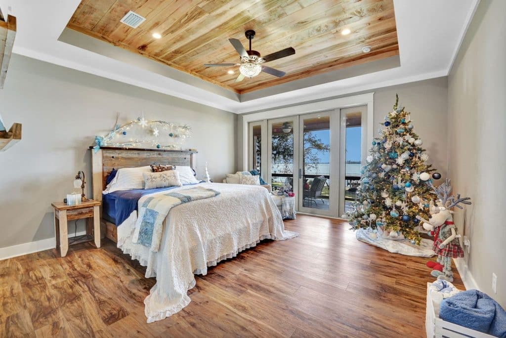 Barros home master bedroom with view of the Bay designed and constructed by Rita Jones Construction in Panama City Florida