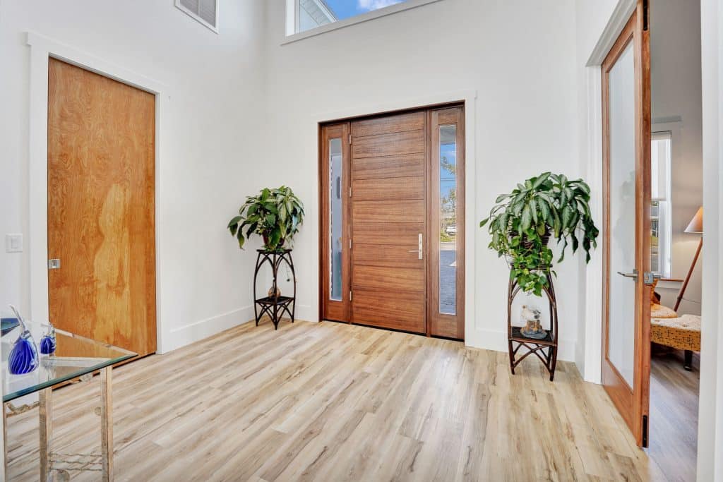 Tubridy grand entry room and large wood front door designed and constructed by Rita Jones Construction in Panama City Florida